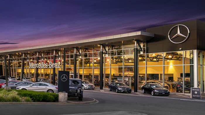 The Mercedes-Benz dealership at dusk