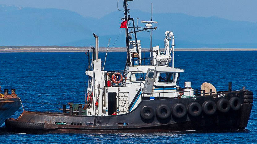 A Hodder Tugboat Co tug alongside a barge